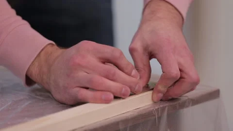 Two slats connected together by an iron corner and a self-tapping screw Stock Footage 95528109