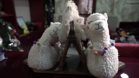 Two sleeping Lamb dolls on the table Stock Footage 197104185