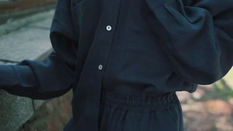 Two slender girlfriends in white and blue linen shorts. Video stock 151068404