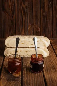Two Slice of Crafted Brie Cheese with Honey on Wooden Brown Background with F Stock Photos