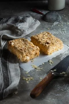 Two slice of napoleon cake on gray wooden background Stock Photos