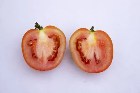 Two Slice  Ripe Red  Tomato On isolated Background Stock Photos