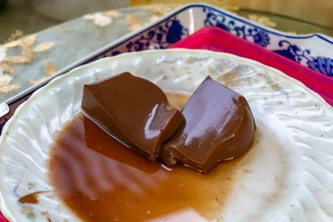 Two slice of smooth, glossy chocolate pudding Stock Photos