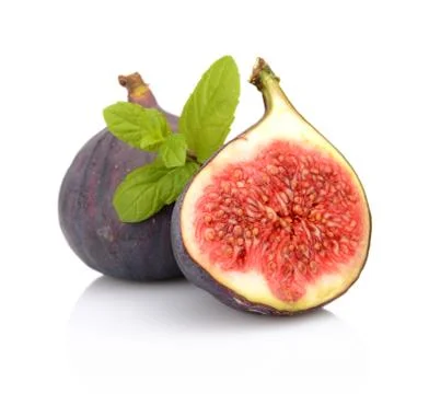Two sliced figs lengthwise in half with mint, isolated on white background Stock Photos