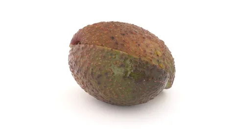 Two slices of avocado slowly rotates on turn table. Isolated on white. Stock Footage 88631239