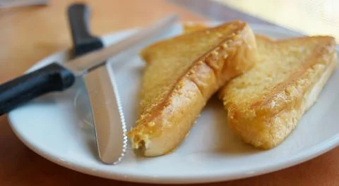 Two slices of baked bread on plate Stock Photos