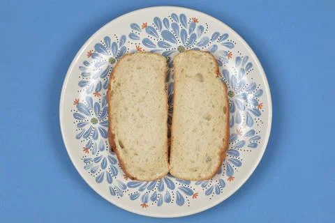 Two slices of fresh bread on a decorated plate Stock Photos