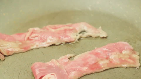 Two Slices Of Fresh Gentlest Bacon Quickly Browns With Excreting Fragrant Juice Stock Footage 99887658