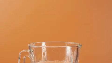 Two slices of fresh pineapple falling blender with water Stock Footage 125926889