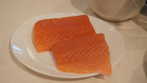 Two slices of red fish fillet on a plate Stock Footage 150227155