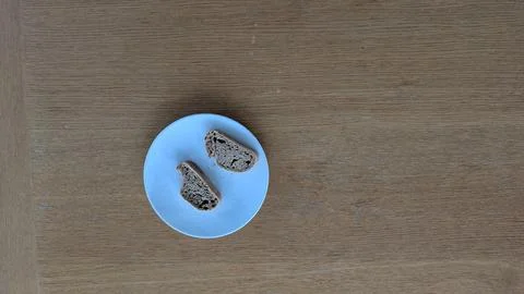 Two slices of rustic bread on a blue plate Stock Photos