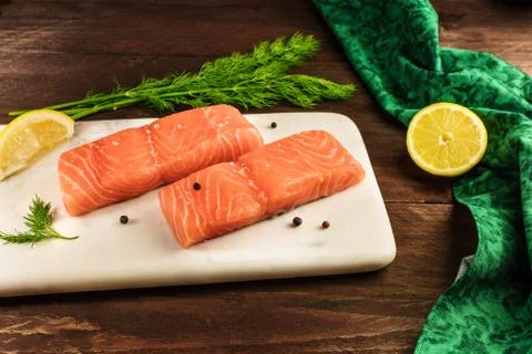 Two slices of salmon on dark background with copyspace Fotos Stock