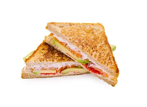 Two slices of toasted bread with vegetables and spread cut in half Stock Photos