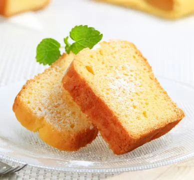Two slices of vanilla pound cake on plate Stock Photos