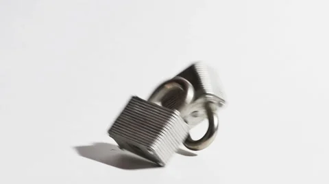 Two Sliver Pad Lock and Keys Falling in Slow Motion Isolated on White Stock Footage 62835297