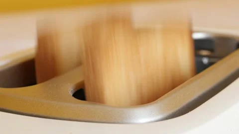 Two-slot automatic electric toaster ejects toasted bread 4K footage Stock Footage 96734660