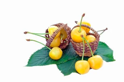 Two small baskets with yellow cherries Stock Photos