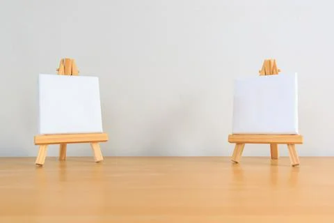 Two small blank canvas on tiny wooden easels Stock Photos