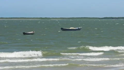 Two Small Boats Float on Blue-Green Ocean Waves - Tutoia, Brazil Stockbeeldmateriaal 331517479