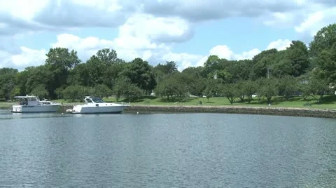Two small boats moored along the shore. Stock Footage 8981848