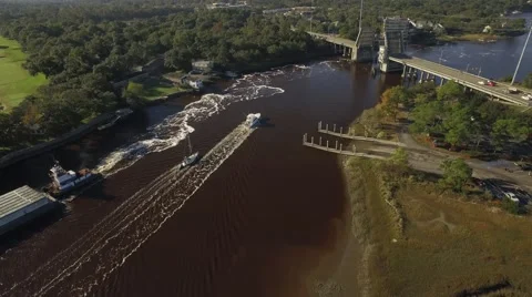 Two Small Boats Moving to Pass Through an Open Toll Bridge Stock Footage 57678047