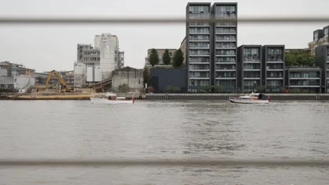 Two small boats moving on the River Thames one after another 動画素材 234069103