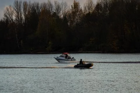 Two small boats moving on river in Riga Foto stock