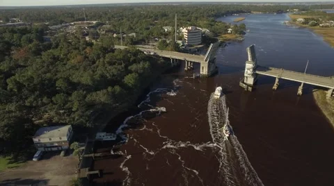 Two Small Boats Pass Through a Toll Bridge Stock Footage 57677886