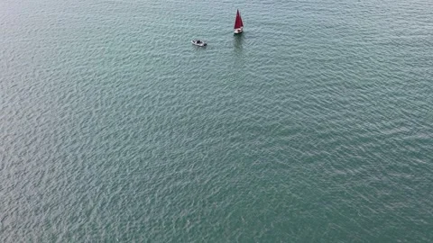 Two small boats sailing across vast open water Stock Footage 339532359