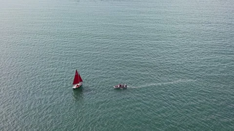 Two small boats sailing across vast open water Stock Footage 339532935