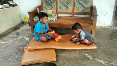 Two small boys playing android Stock Footage 263641939