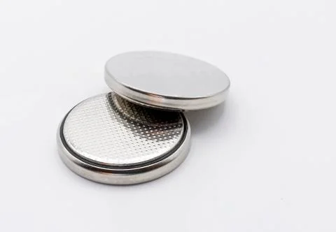 Two small button lithium batteries isolated on a white background Stockfoto's