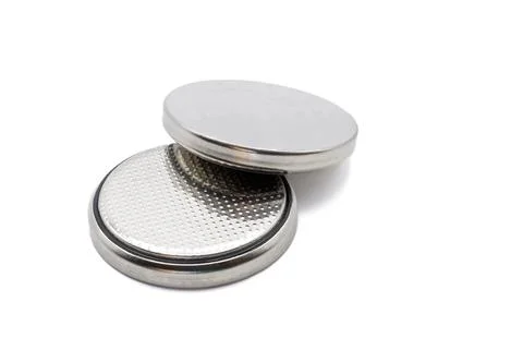 Two small button lithium batteries isolated on a white background Stock Photos