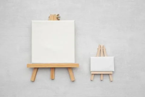 Two small canvases on the easels. Stock Photos
