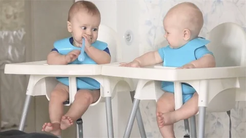 Two small children waiting for their lunch Stock Footage 79886896