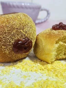 Two small cornbreads filled with guava paste and cornmeal on the table. Stock Photos