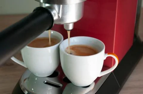 Two small cups with espresso coffee. Morning breakfast drink. Red coffee mach Stock Photos