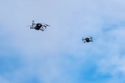 Two small drones flying in the sky Stock-Fotos