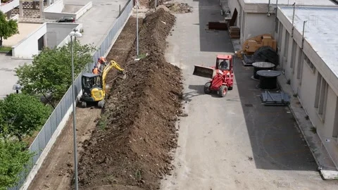 Two small excavators   at work on a construction site Stock-Footage 242947190