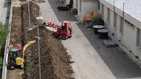 Two small excavators at work on a construction site 库存影片 242947550