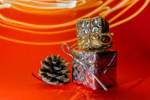 Two small gifts on a red background. Gifts in honor of the new year. Stock Photos