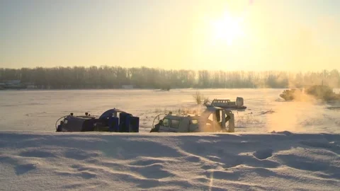 Two small hovercrafts stand with the engine running Stock Footage 86079282