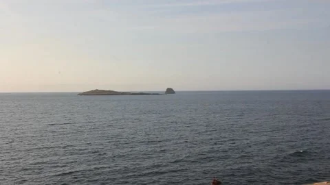 Two small islands in front of the Cantabrian coast Stock Footage 313164769