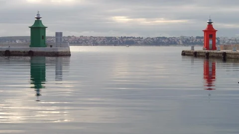 Two small lighthouse in red and green color at entrance in harbor Stock Footage 100367637