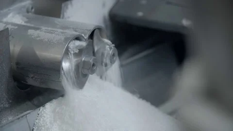 Two small mills rotating with white powder Stock Footage 70277794