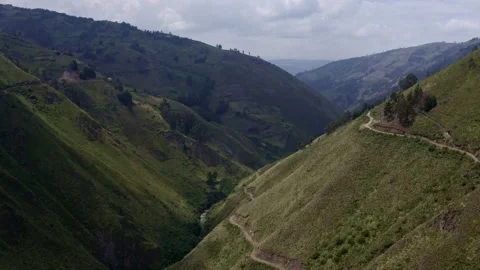Two small mountain roads are running over the steep slopes of the Andes Stock Footage 169958428