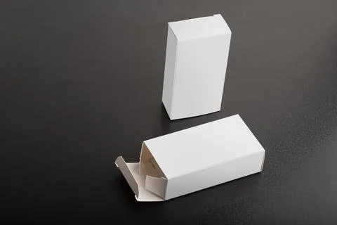 Two small packages on dark background mock-up series Stock Photos