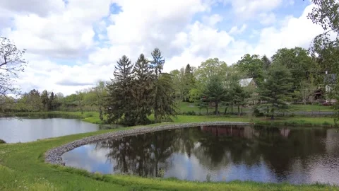 Two small ponds in a country setting Stock Footage 154132371