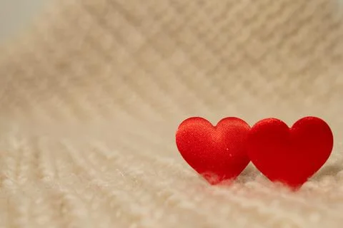 Two Small Red Hearts Displayed Together on a Fluffy White Blanket Stock Photos