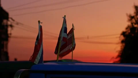 Two Small Thai National Flags on Car Roof Waving Stock Footage 333292315